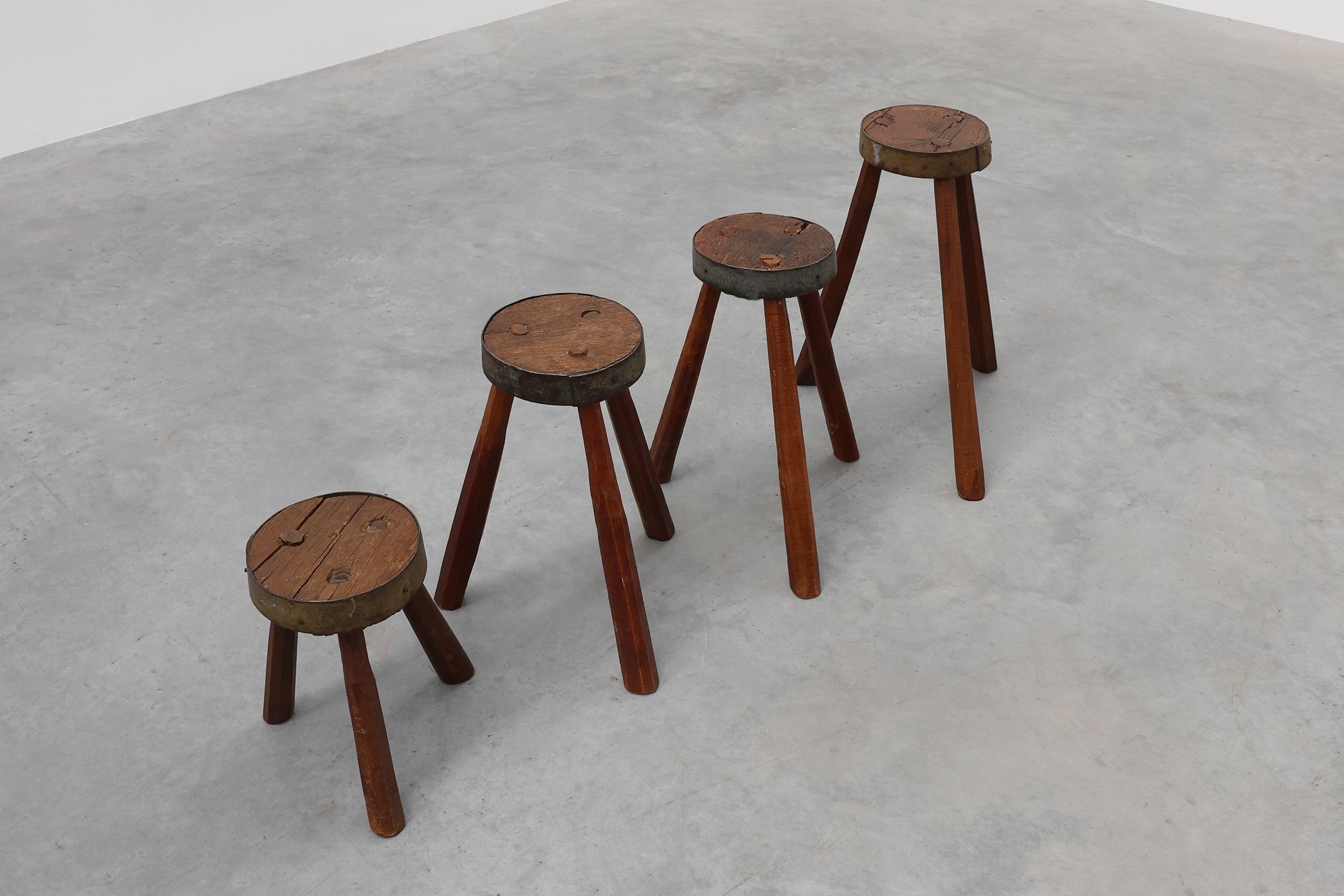 Brutalist French 1850s solid oak tripod stools with metal rim, set of 4thumbnail
